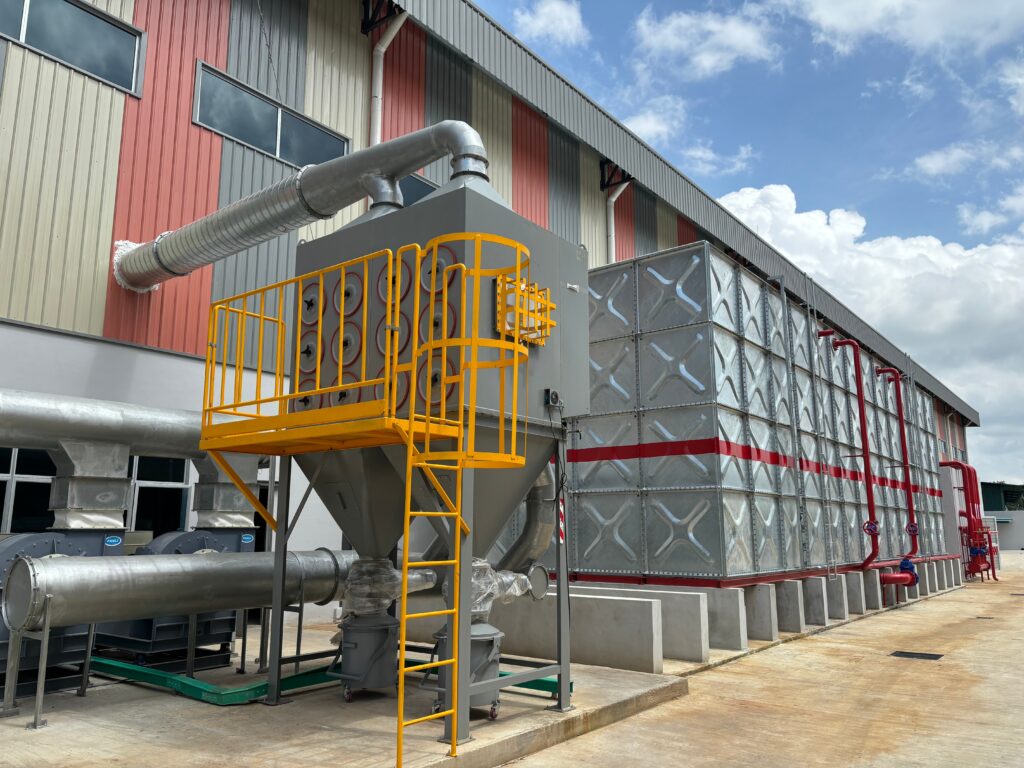 Industrial dust collector system and blower fans installed outside factory for air filtration and ventilation efficiency